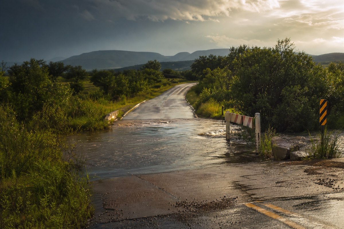 A U.S. weather outlook scene combines dangerous heat, heavy rain, and flash-flood preparedness.