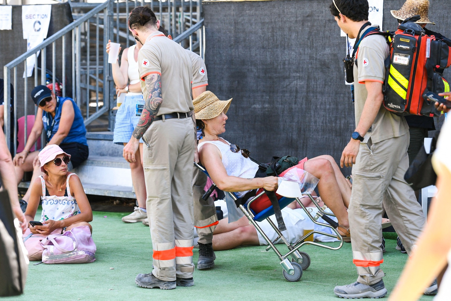 Emergency workers assist people affected by extreme heat in France.